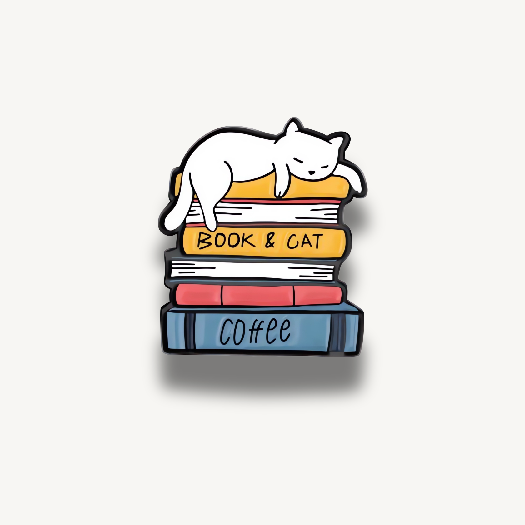 Biela mačka spiaca na farebnej kope kníh. Na knihách sú nápisy BOOK & CAT a COFFEE.