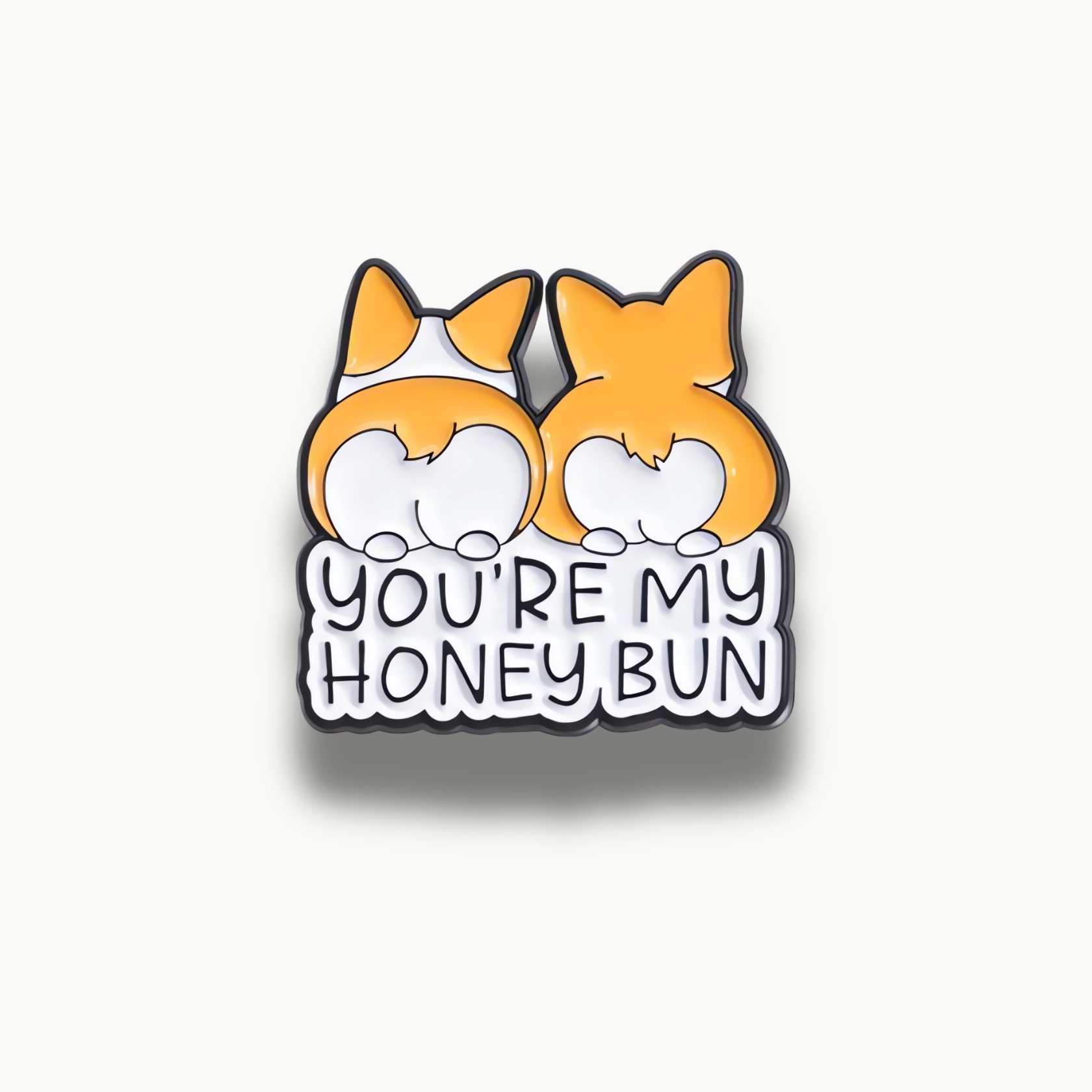 Smaltovaná brošňa s dvoma oranžovými psími zadočkami a nápisom You're My Honey Bun