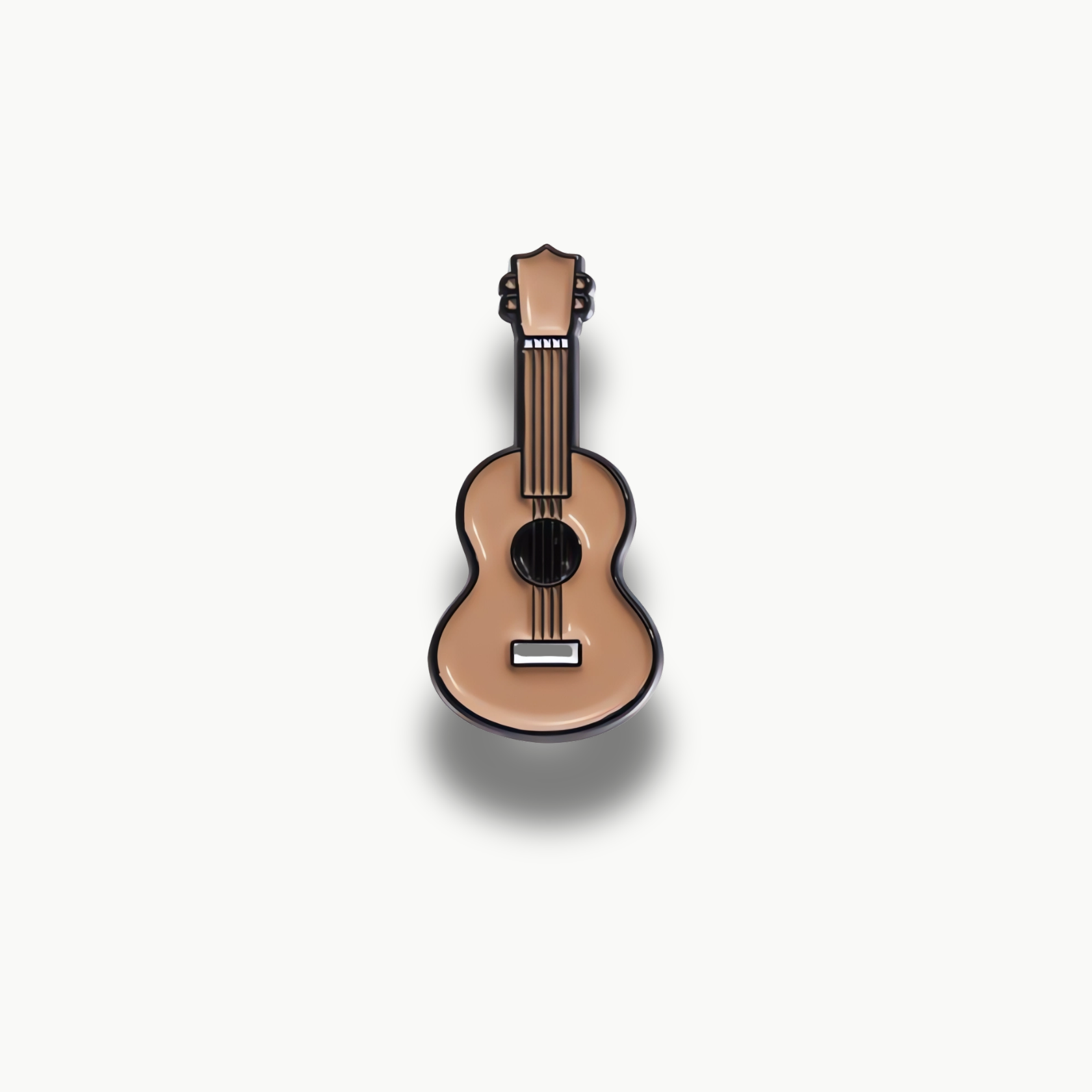 Smaltovaná brošňa v tvare béžovej akustickej gitary s čiernymi detailmi.