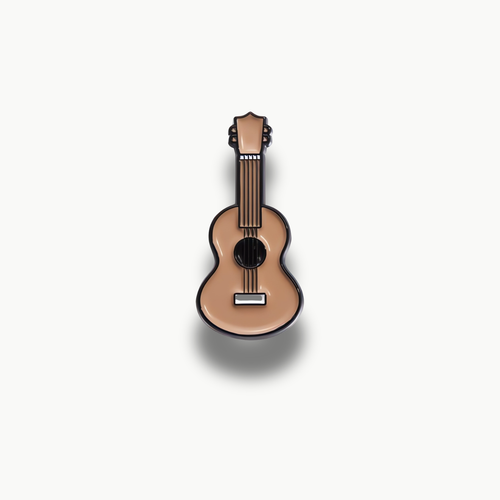 Smaltovaná brošňa v tvare béžovej akustickej gitary s čiernymi detailmi.