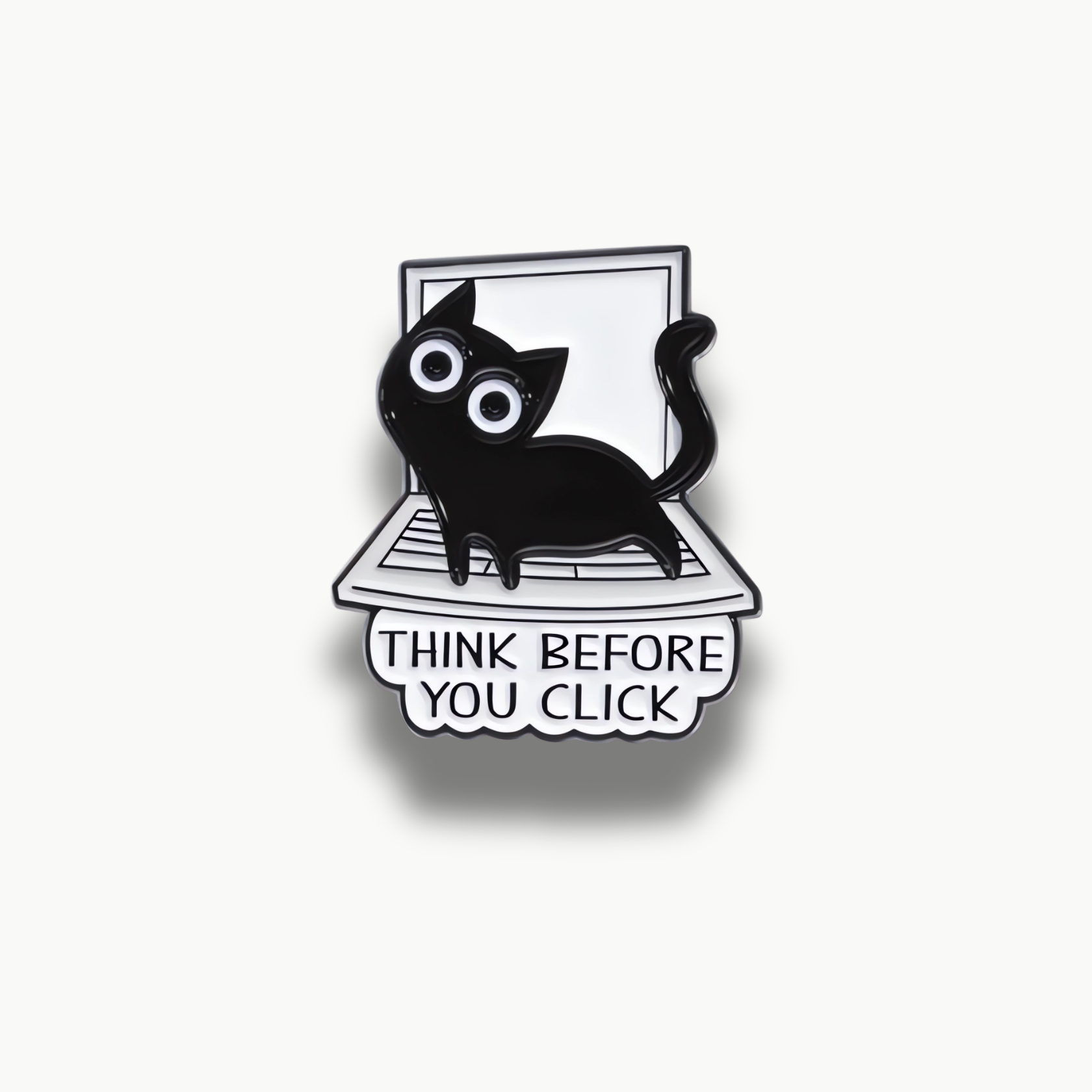 Čierna mačka na bielom notebooku s nápisom Think Before You Click